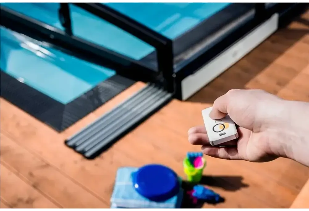 White solar-powered Moover electric motor with a rectangular remote control and yellow accent